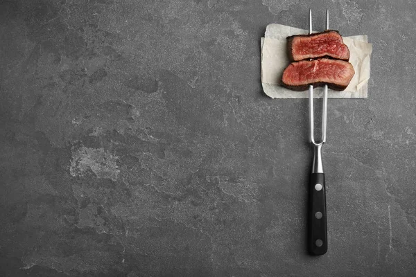 Carving Fork Slices Delicious Beef Steak Grey Table Top View — Stock Photo, Image