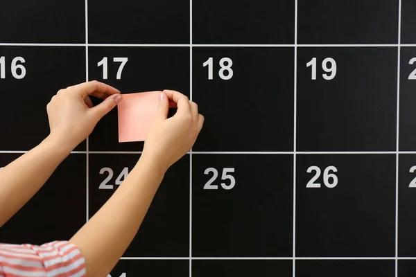 Woman Putting Sticker Board Calendar Closeup — Stock Photo, Image