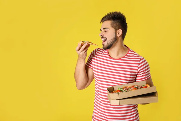 Handsome Man Eating Tasty Pizza Yellow Background — Stock Photo, Image