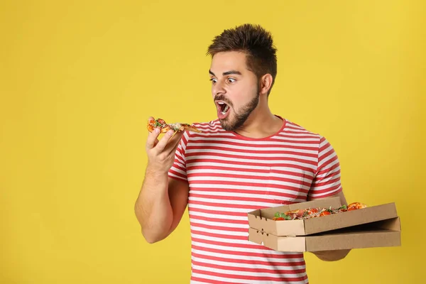Emotional Man Tasty Pizza Yellow Background — Stock Photo, Image