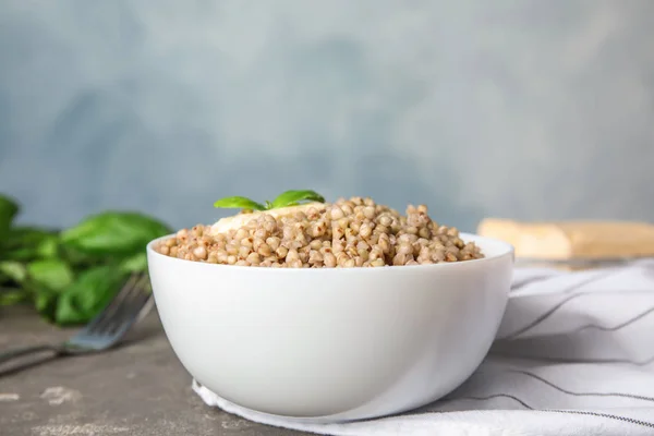 Tasty Buckwheat Porridge Butter Grey Table — Stock Photo, Image