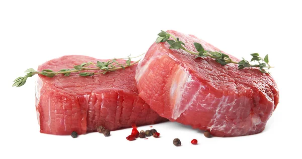 Fresh raw beef cut with thyme and peppers mix isolated on white — Stock Photo, Image