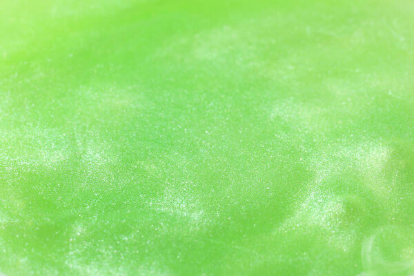 Closeup view of green slime as background. Antistress toy