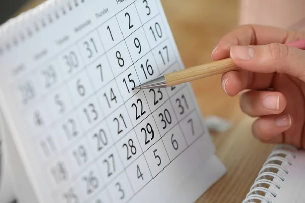 Woman Making Schedule Using Calendar Wooden Table Closeup — Stock Photo, Image