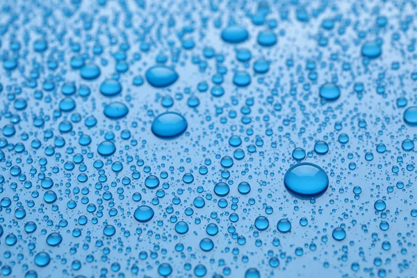 Vatten Droppar Ljusblå Bakgrund Närbild — Stockfoto