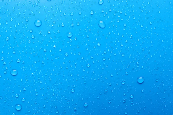 Vatten Droppar Ljusblå Bakgrund Ovanifrån — Stockfoto
