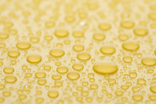 Water Drops Yellow Background Closeup View Stock Image