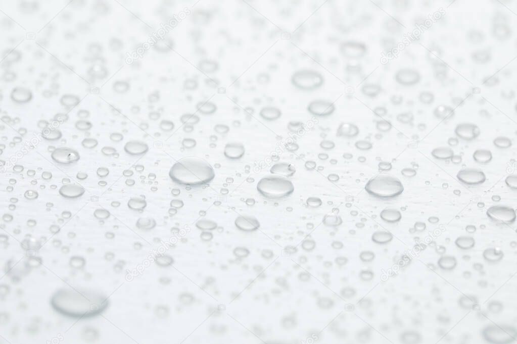 Water drops on white background, closeup view