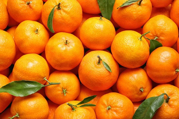 stock image Delicious fresh ripe tangerines as background, top view