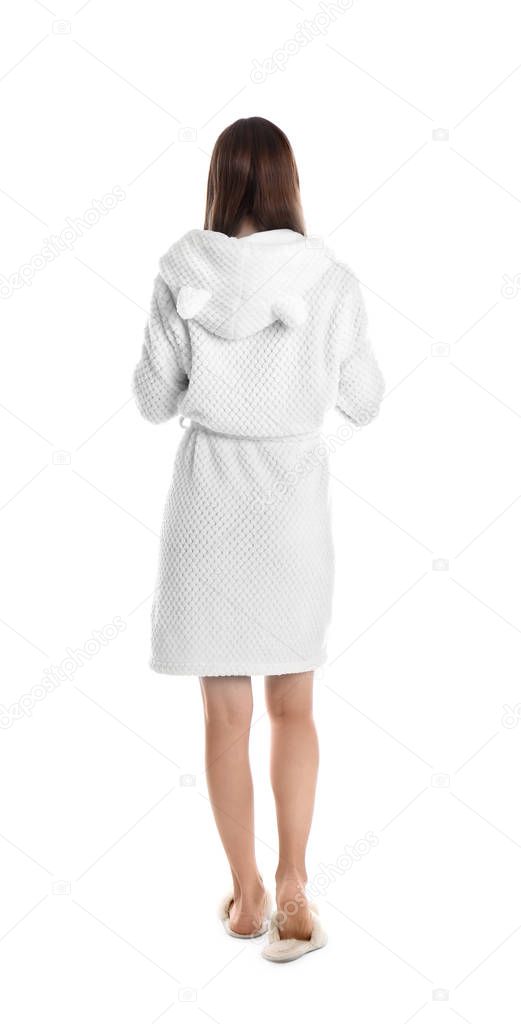 Young woman in bathrobe on white background