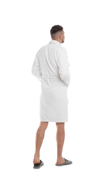 Man wearing bathrobe and slippers on white background — Stock Photo, Image