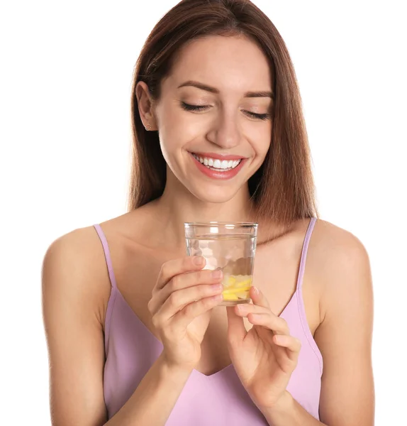 Young woman with glass of lemon water on white background — Stock Photo, Image