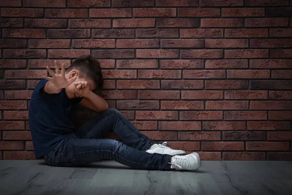 Scared Little Boy Closing Eyes Hand Floor Brick Wall Child — Stock Photo, Image