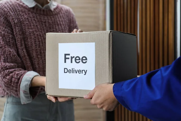 Woman Receiving Parcel Sticker Free Delivery Courier Indoors Closeup — Stock Photo, Image