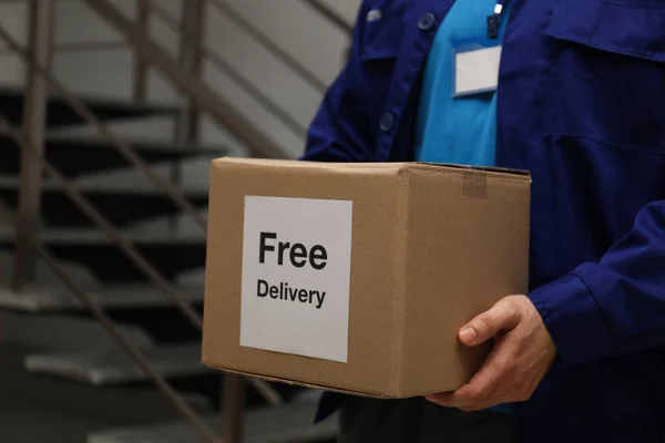 Courier Holding Parcel Sticker Free Delivery Indoors Closeup — Stock Photo, Image