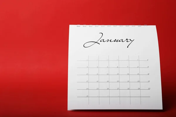 Calendrier papier sur fond rouge. Concept de planification — Photo