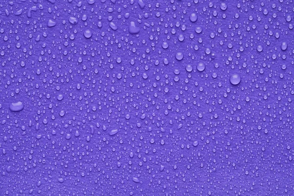 Waterdruppels Lila Achtergrond Bovenaanzicht — Stockfoto