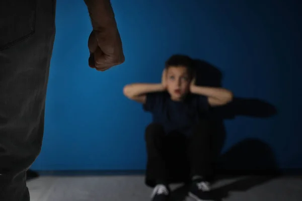 Man Threatens His Son Blue Background Focus Hand Domestic Violence — Stock Photo, Image