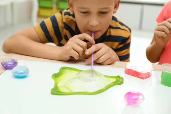 Little Boy Blowing Slime Bubble White Table Indoors Closeup — Stock Photo, Image