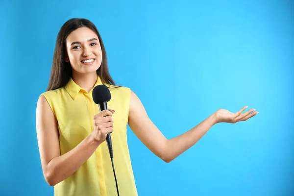 Young Female Journalist Microphone Blue Background — ストック写真