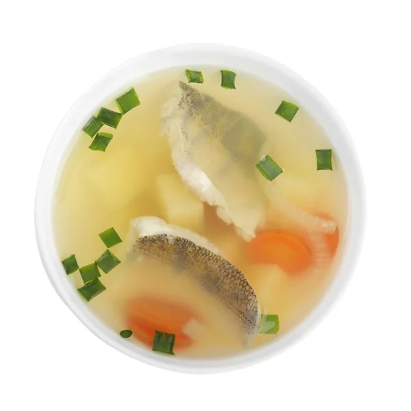 Delicious fish soup in bowl isolated on white, top view — Stock Photo, Image