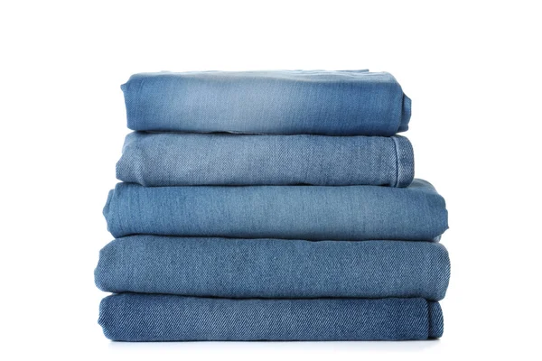 Stack of different jeans isolated on white — Stock Photo, Image