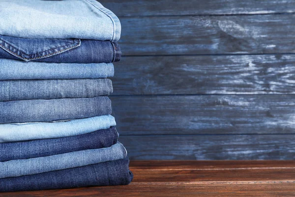 Stack Different Jeans Wooden Table Space Text — Stock Photo, Image
