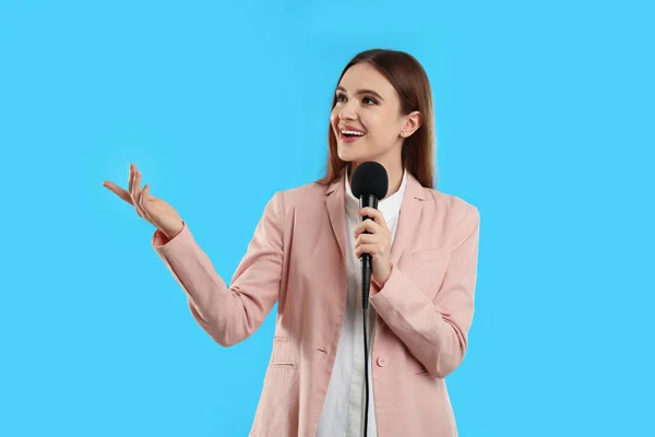 Young Female Journalist Microphone Blue Background — 图库照片