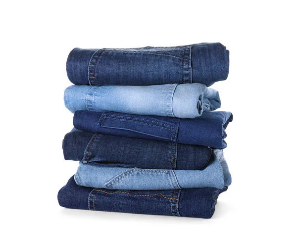 Stack of different jeans isolated on white — Stock Photo, Image