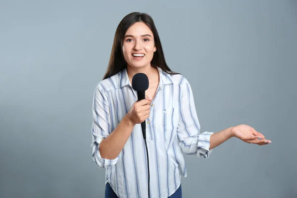 Young Female Journalist Microphone Grey Background — ストック写真