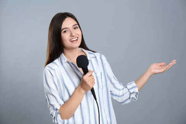 Young Female Journalist Microphone Grey Background — ストック写真