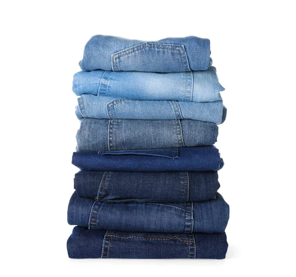 Stapel van verschillende jeans geïsoleerd op wit — Stockfoto