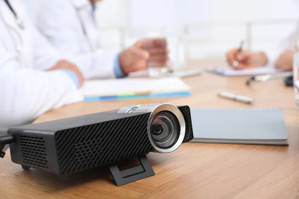 Video projector on table during medical conference