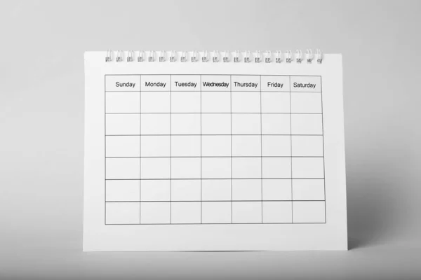 Blanco papieren kalender op grijze achtergrond. Planningsconcept — Stockfoto