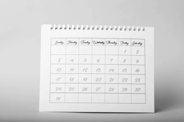 Calendrier en papier sur fond gris. Concept de planification — Photo