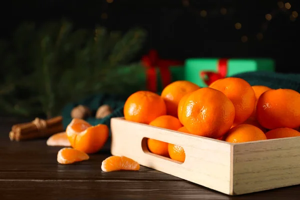 Tasty fresh tangerines on wooden table. Christmas celebration — Stock Photo, Image