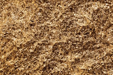 Arkaplan olarak buruşuk altın folyo, üst görünüm