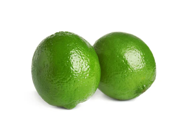 Fresh green ripe limes isolated on white — Stock Photo, Image