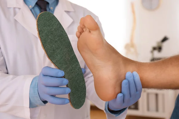 Male Orthopedist Fitting Insole Patient Foot Clinic Closeup — Stock Photo, Image