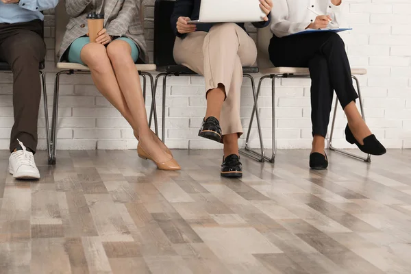 People waiting for job interview in office, closeup