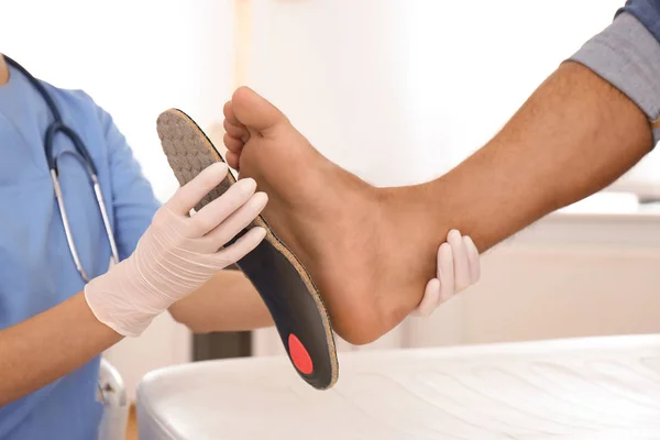 Female Orthopedist Fitting Insole Patient Foot Clinic Closeup — Stock Photo, Image