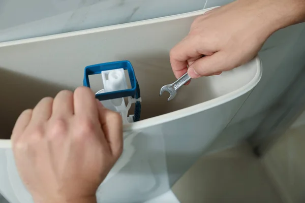 Professional Plumber Repairing Toilet Bathroom Closeup — ストック写真