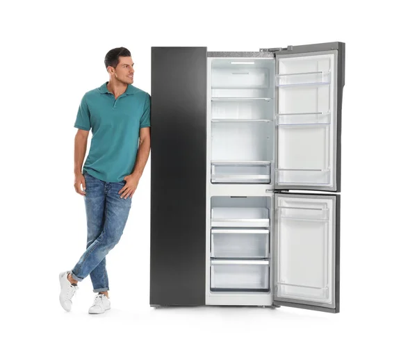 Человек Рядом Открытым Пустым Холодильником Белом Фоне — стоковое фото