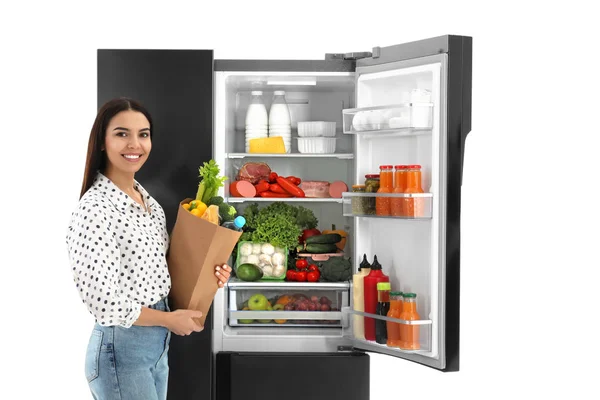 Young Woman Bag Groceries Open Refrigerator White Background — Stock Photo, Image