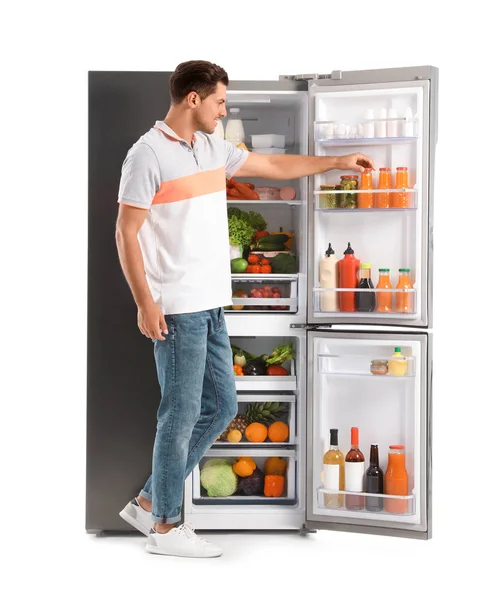 Hombre Tomando Jugo Del Refrigerador Sobre Fondo Blanco — Foto de Stock