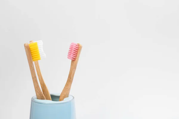 Bamboo toothbrushes in holder isolated on white — Stock Photo, Image