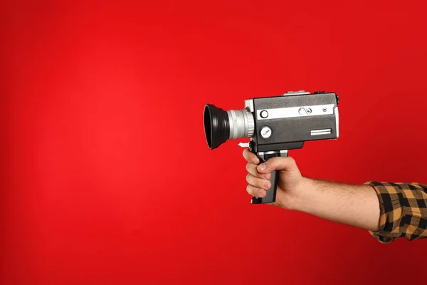 Man Vintage Video Camera Red Background Closeup Hand Space Text — Stock Photo, Image