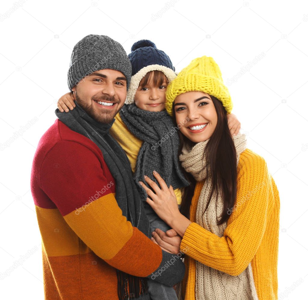 Happy family in warm clothes on white background. Winter vacation