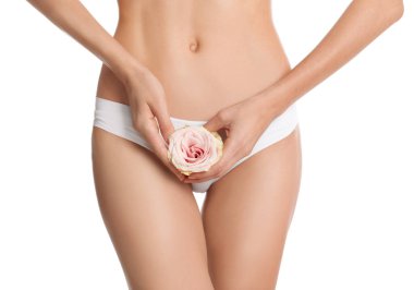 Woman with flower showing smooth skin after bikini epilation on white background, closeup. Body care concept clipart