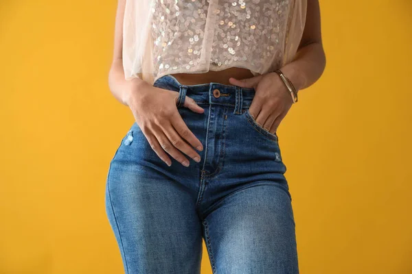 Woman Wearing Jeans Yellow Background Closeup — ストック写真